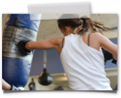 girl boxing heavy bag